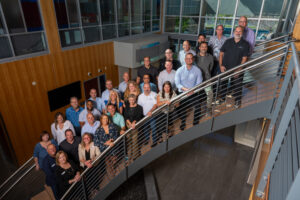 Envera Systems Employees in a group photo on a large staircase